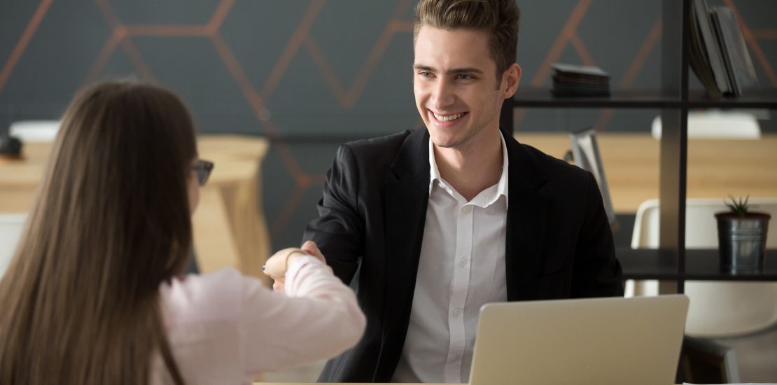 A guy accepcting the offer letter for the position embedded software engineer